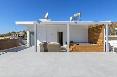 a house with a large glass extension on a roof at NEW Dodekanisou 53 Glifada in Athens
