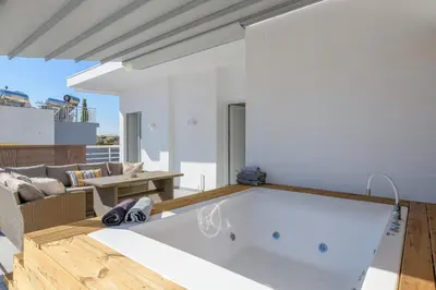 a large white bath tub in a living room at NEW Dodekanisou 53 Glifada in Athens
