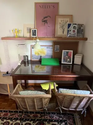 a desk with two wicker chairs in a room at Bamboo & Bird House, Chalandri in Athens