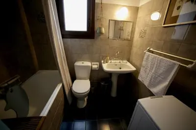 a small bathroom with a toilet and a sink at Bamboo & Bird House, Chalandri in Athens