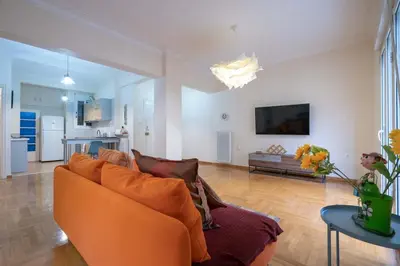a living room with a couch and a table at Blue Harmony 3BR - Heart of Athens by ΜΡS in Athens