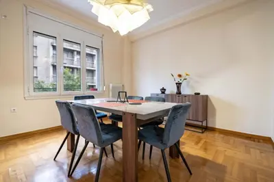 a dining room with a table and chairs at Blue Harmony 3BR - Heart of Athens by ΜΡS in Athens