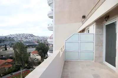a balcony with a view of a city at Best House Kalipso Neo Faliro Piraeus in Piraeus