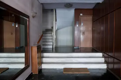 a hallway with stairs in a building at Best House Kalipso Neo Faliro Piraeus in Piraeus
