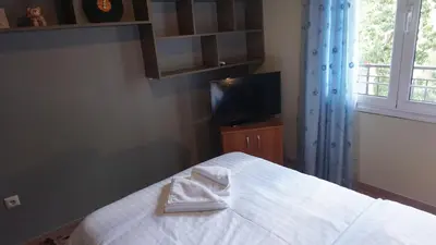 a bedroom with a bed with a towel on it at George Luxury Apartments in Athens
