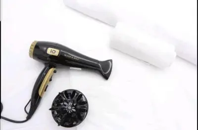 a hair dryer and a roll of paper on a table at New Korinis 3 Athens studio in Athens
