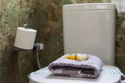 a banana sitting on top of a towel on a toilet at Luxury Retreat with Iconic Acropolis View Koukaki in Athens