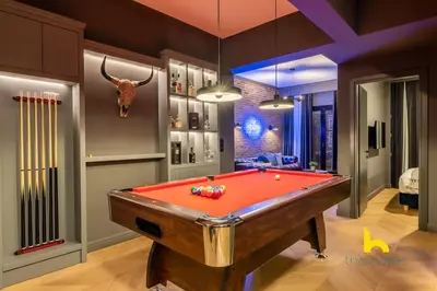 a room with a pool table with horns on the wall at Unique Urban Cave w Pool Table Near Acropolis! in Athens