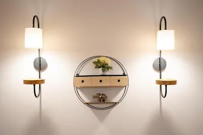 a mirror on a wall with two lights and a shelf at Steps from the Heart of Zografou- 3 Guests by ΜΡS in Athens