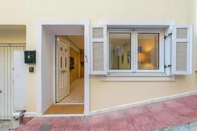 an open door of a building with a window at Two steps from Acropolis in Athens