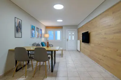 a dining room with a table and chairs at Two steps from Acropolis in Athens