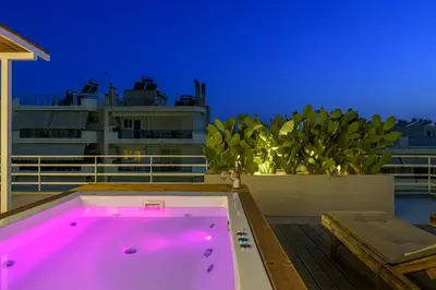 a hot tub on the deck of a cruise ship at Jacuzzi Penthouse with sea view 5th floor in Athens