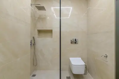 a bathroom with a shower with a toilet in it at Brand new 3bedrooms apartment in Athens