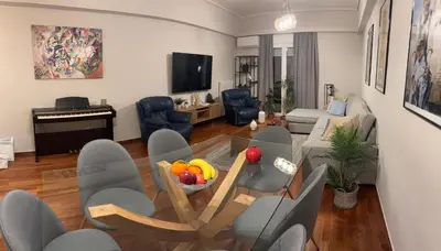 a living room with a table with fruit on it at Amalia cosy home in Athens