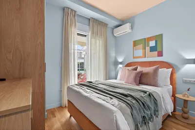 a bedroom with a bed and a window at Fireside Kallithea - Large Veranda II - 3BR by ΜΡS in Athens