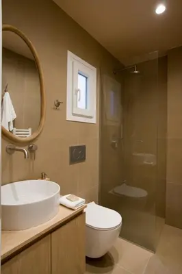 a bathroom with a sink and a toilet and a shower at Fireside Kallithea - Large Veranda II - 3BR by ΜΡS in Athens