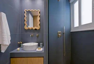 a bathroom with a sink and a mirror on the wall at Fireside Kallithea - Large Veranda I -2BR by ΜΡS in Athens