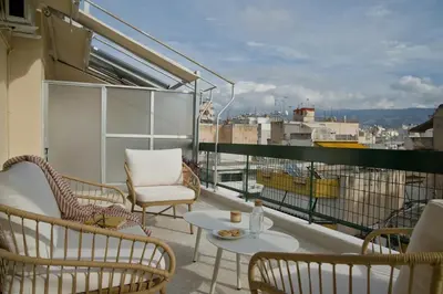 a balcony with chairs and a table with a view at Fireside Kallithea - Large Veranda I -2BR by ΜΡS in Athens