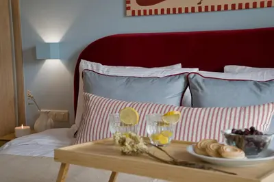 a table with a tray of food on a bed at Fireside Kallithea - Large Veranda I -2BR by ΜΡS in Athens