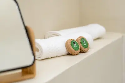 two rolls of toilet paper on a table with a laptop at Athensis Central Suites in Athens