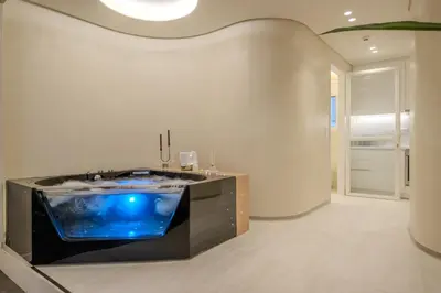 a large room with a tub in the middle of it at Athensis Central Suites in Athens