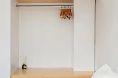 a sliding glass door in a bedroom at An Interior in Its Purest Form in Athens