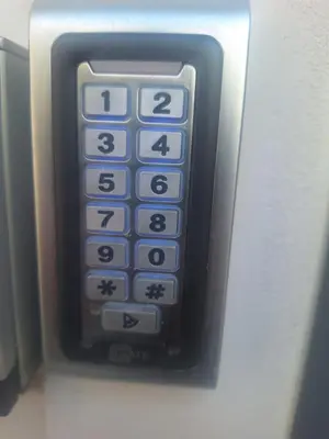 a remote control sticking out of an office phone at Sunshine houses one in Athens