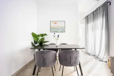 a dining room with a table and two chairs at Bright Cozy 2BR l Private Balcony & Work Corner in Athens