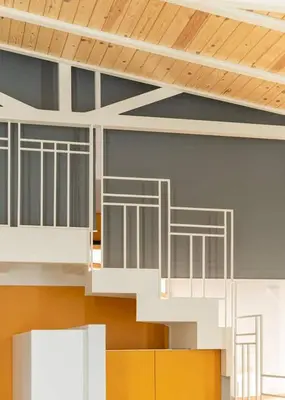 a staircase in a building with wooden ceilings at Alter Athens Downtown in Athens
