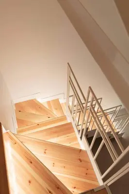 a staircase in a room with wooden flooring and a staircase at Alter Athens Downtown in Athens