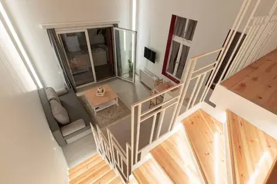 an overhead view of a living room with a table at Alter Athens Downtown in Athens