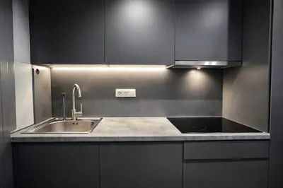 a kitchen with a sink and a stove at Piraeus Port Luxury Suites No3 in Piraeus