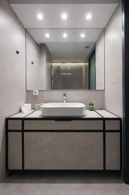 a bathroom with a sink and a large mirror at Piraeus Port Luxury Suites No3 in Piraeus