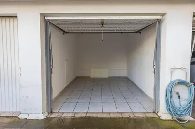 an open garage with a tile floor at Raise Glyfada Sky Residence in Athens