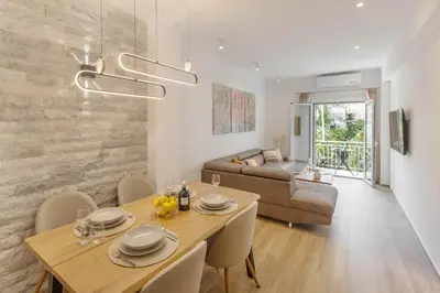 a living room with a table and a couch at Athens Vibes in Kipseli in Athens