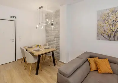 a living room with a couch and a table at Athens Vibes in Kipseli in Athens