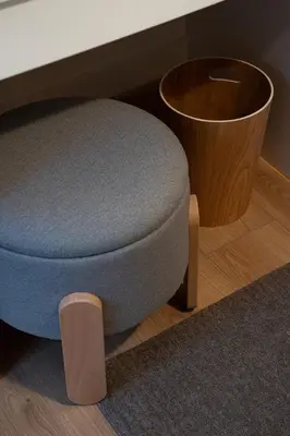 a blue ottoman sitting next to a table at Stylish Modern apartment, 10' from the center! in Athens