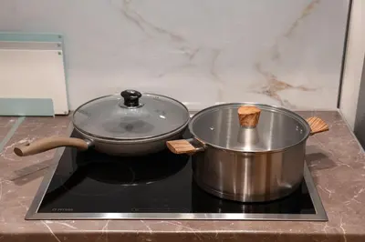 a pot sitting on top of a stove at Stylish Modern apartment, 10' from the center! in Athens