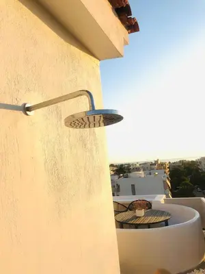 a view from the side of a building with a balcony at Glyfada Amazing Suite with sea view & jacuzzi in Athens