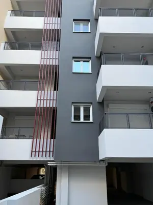 a building with red stripes on the side of it at Estía Cozy City Apartment in Athens