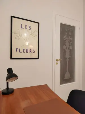 a room with a picture of flowers on the wall at Tranquil Athenian Home - City Center in Athens