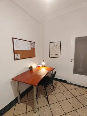 a wooden table in a room with a chalkboard at Tranquil Athenian Home - City Center in Athens