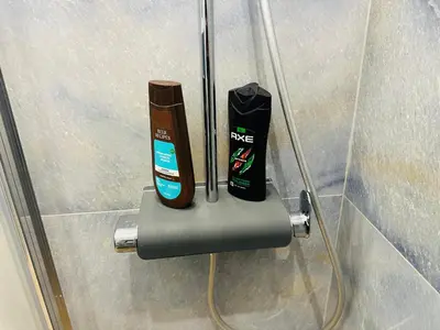 two electric toothbrushes sitting on a holder in a bathroom at Brown Balcony Suite No 1, Piraeus Port in Piraeus