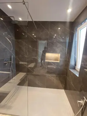 a shower with a glass door in a bathroom at Voula Seaview Residence in Athens