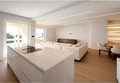 a kitchen and living room with a couch and a table at Voula Seaview Residence in Athens