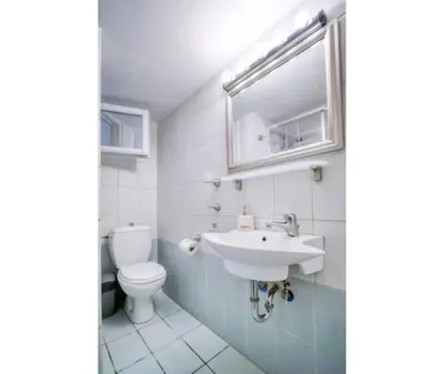 a bathroom with a sink and a toilet at Aria Home - Modern & Classic with Terrace by TT in Athens
