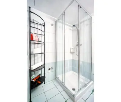 a shower in a bathroom with a glass enclosure at Aria Home - Modern & Classic with Terrace by TT in Athens