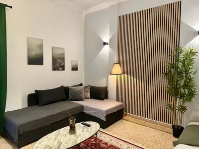 a living room with a couch and a table at Aria Home - Modern & Classic with Terrace by TT in Athens