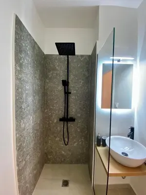 a bathroom with a shower and a sink at ZEN Residence 1 in Athens