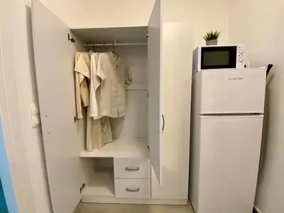 a closet with a refrigerator and a microwave at ZEN Residence 1 in Athens